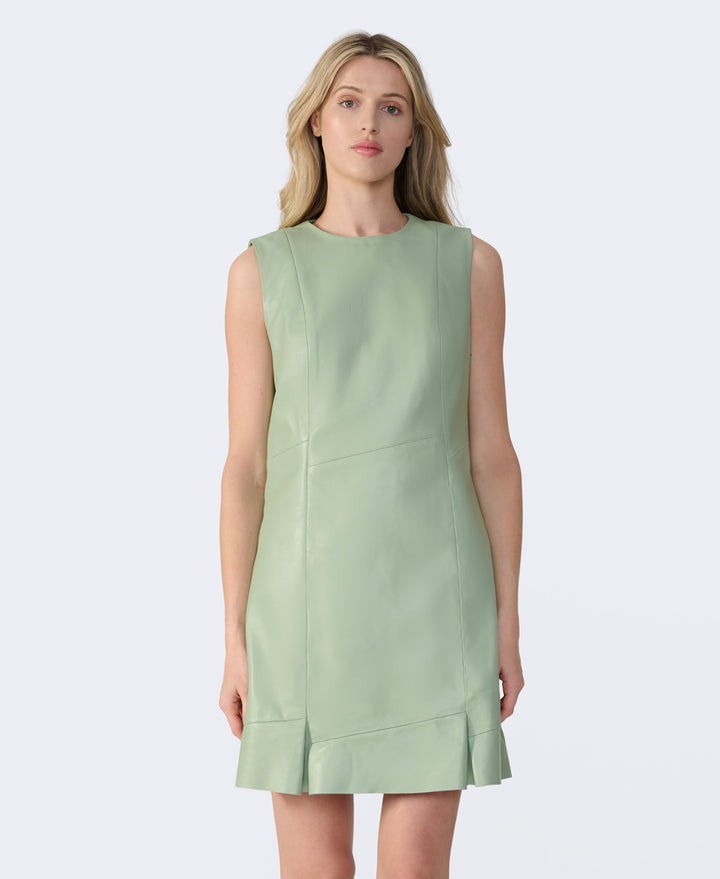 Woman wearing mint green leather dress