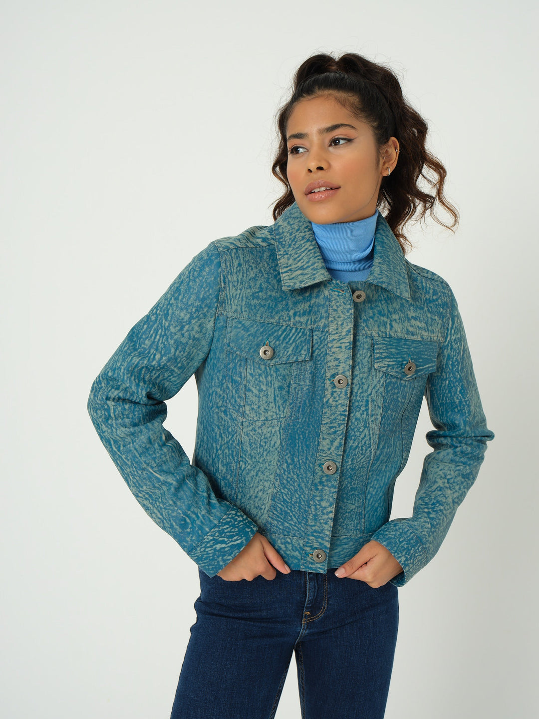 Model wearing blue leather jacket