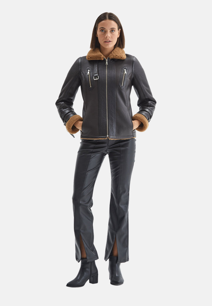 Woman wearing brown sheepskin jacket