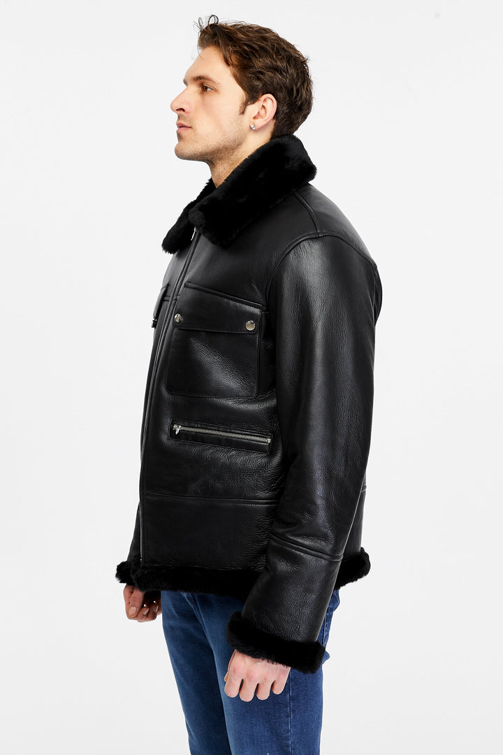 Man wearing black shearling leather jacket