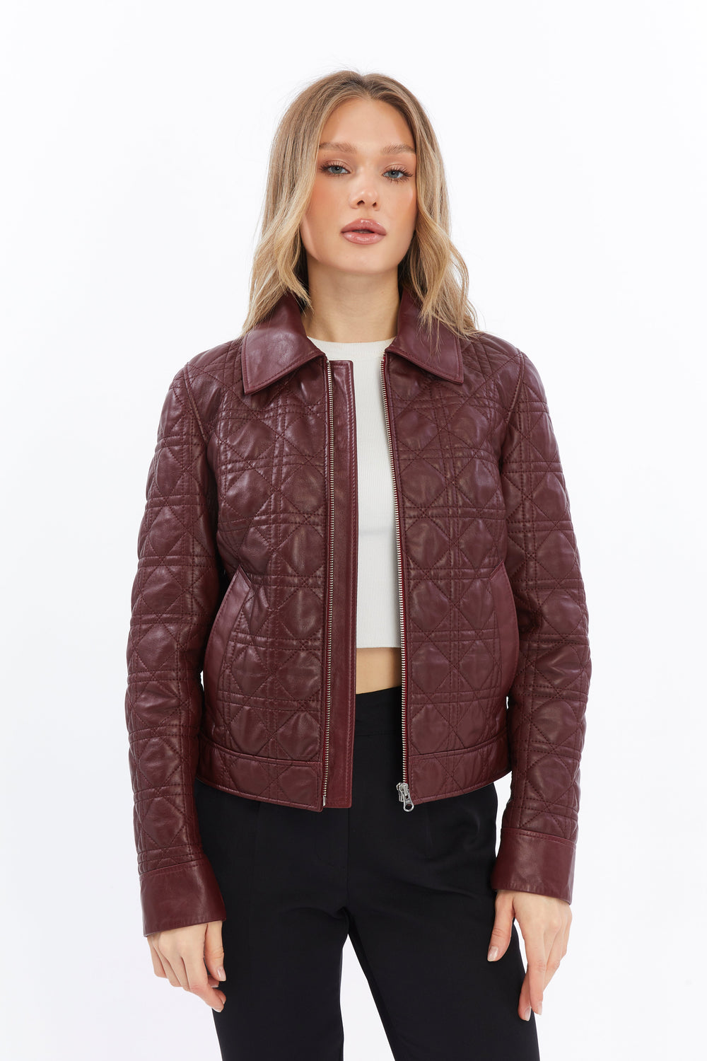 Woman in burgundy quilted leather jacket