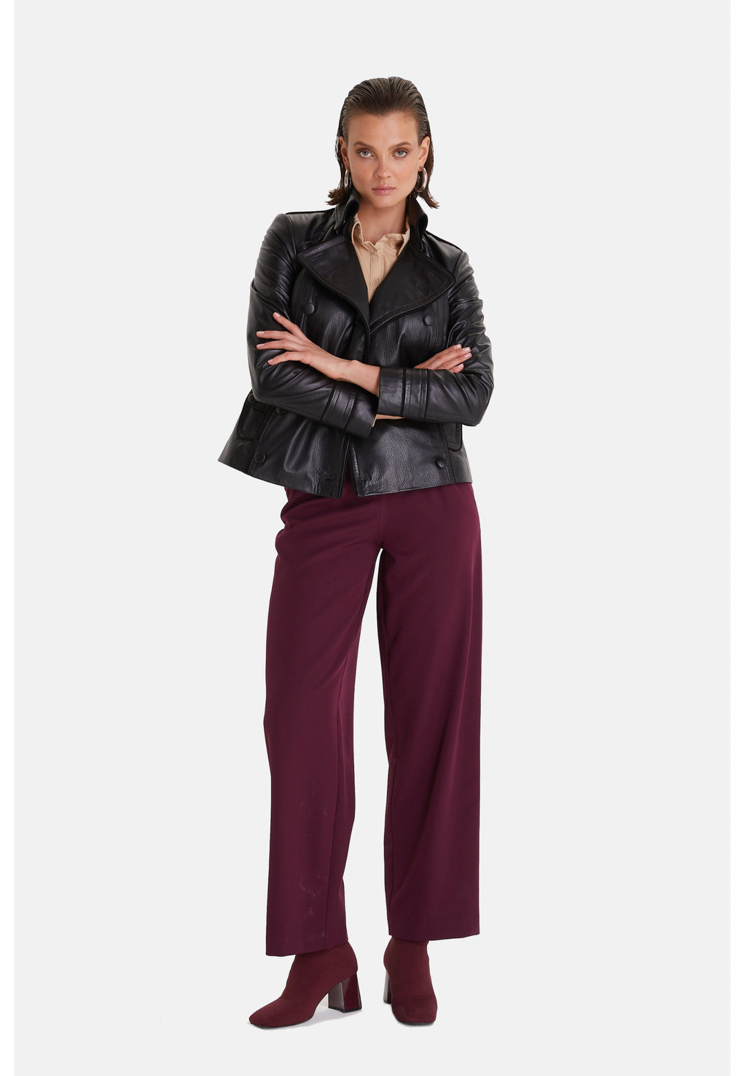 Woman wearing black leather biker jacket