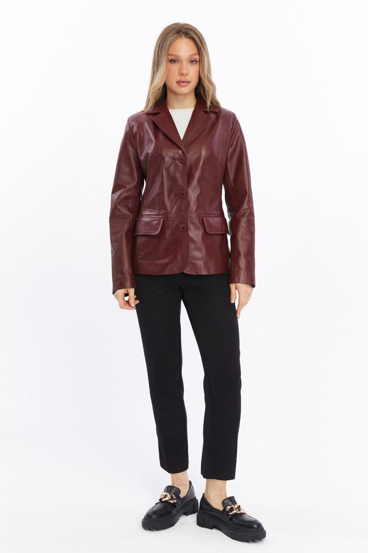 Woman wearing burgundy leather jacket