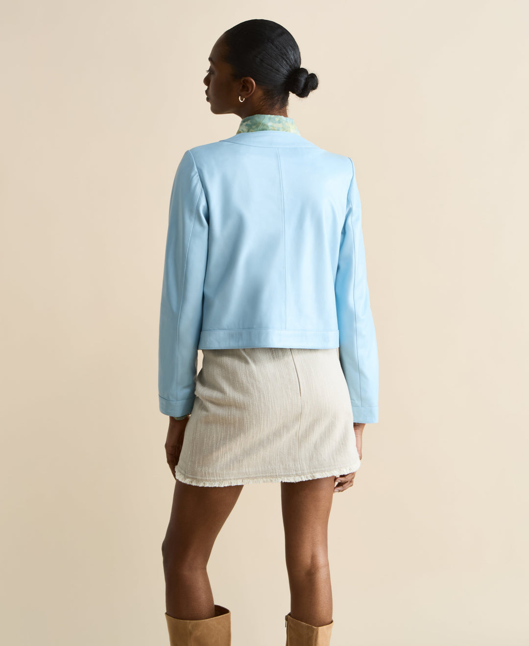 Back view light blue leather jacket