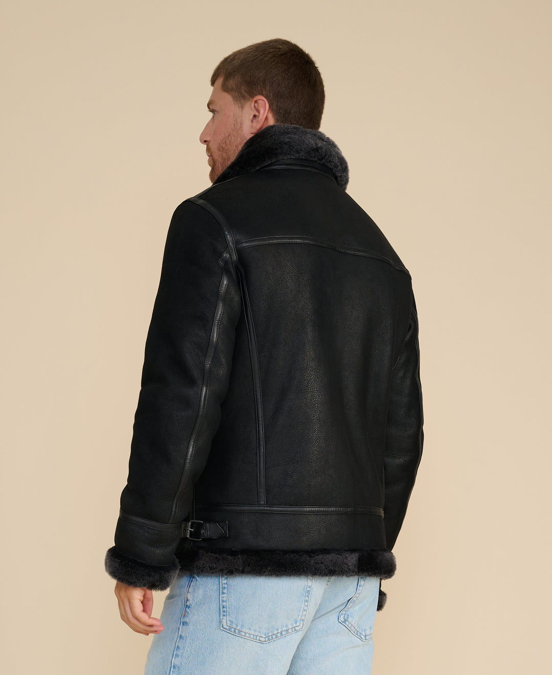Man wearing black shearling aviator jacket