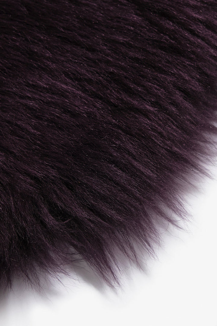 Deep purple sheepskin rug close-up