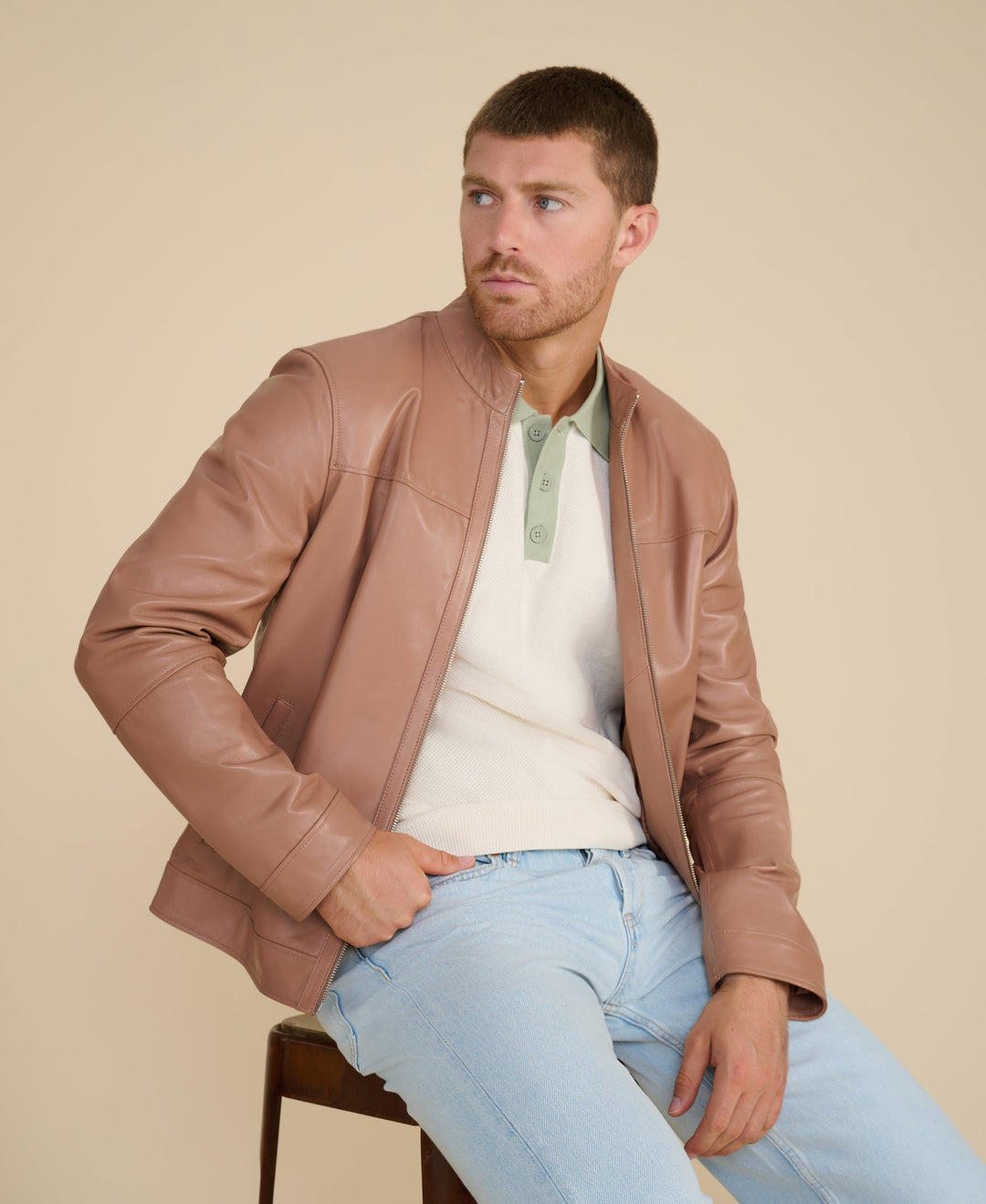 Male model wearing tan racer leather jacket