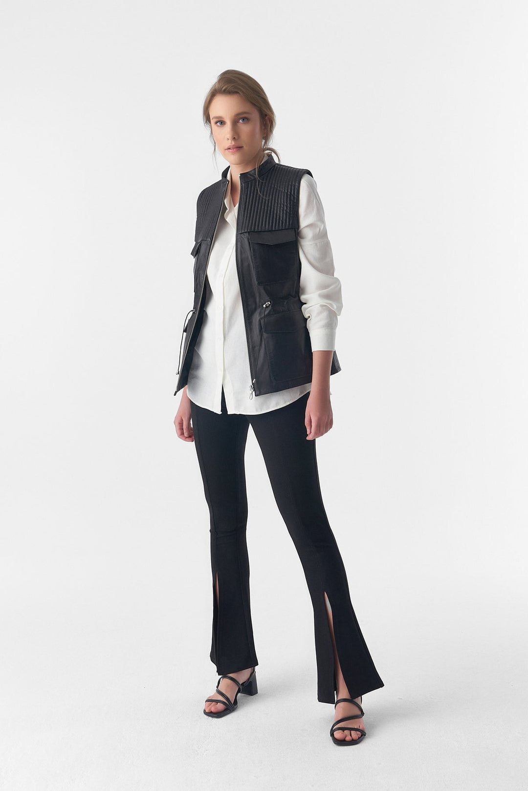 Woman wearing black leather vest