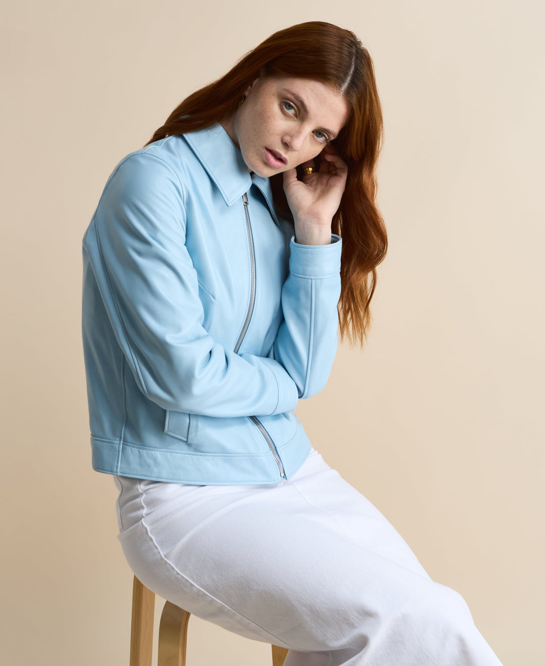 Light blue leather jacket on model