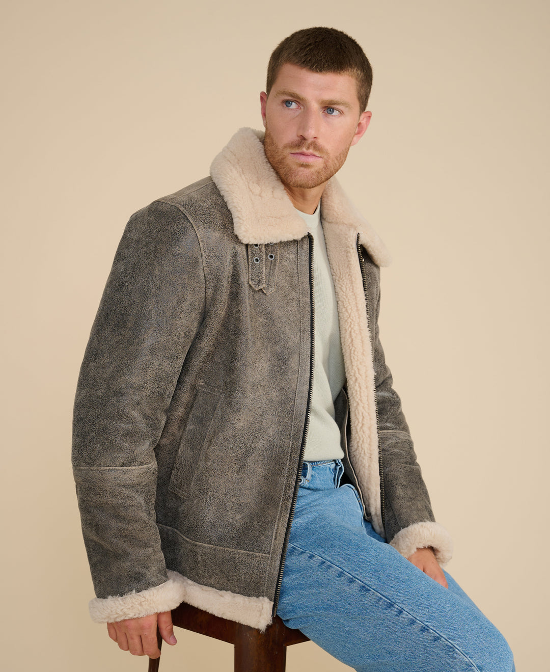 Man wearing shearling aviator jacket