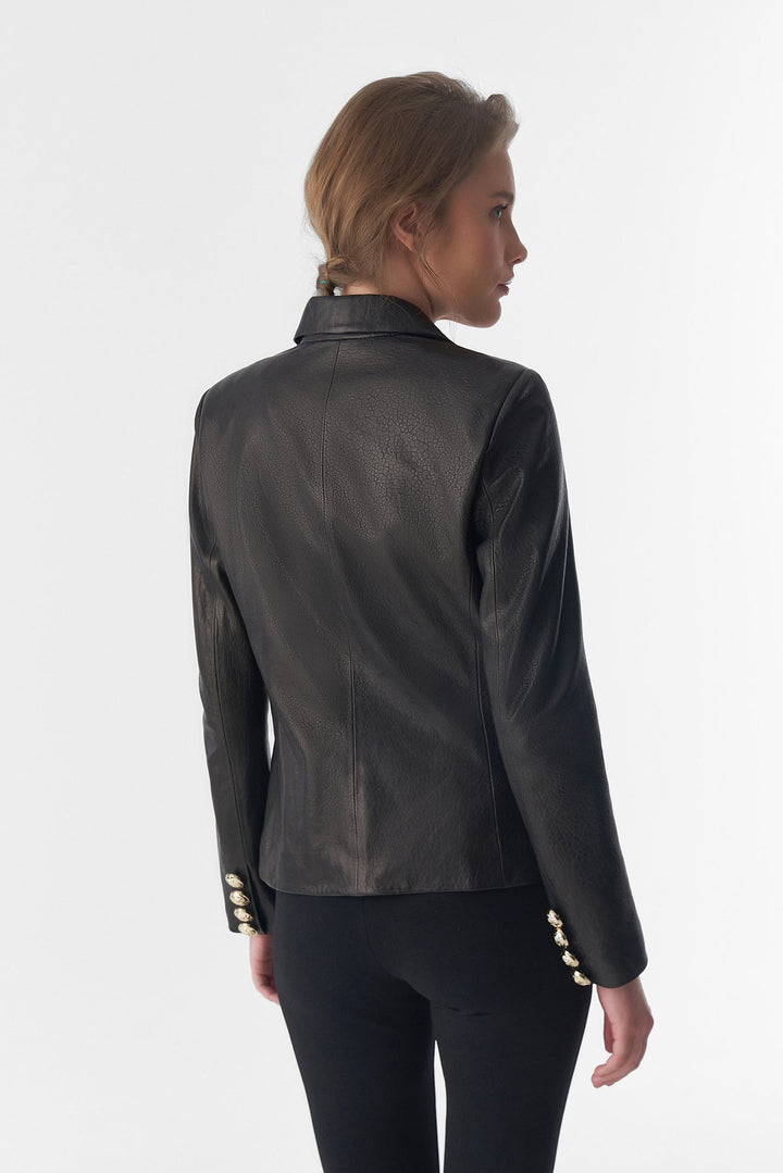 Woman wearing black leather blazer (back)