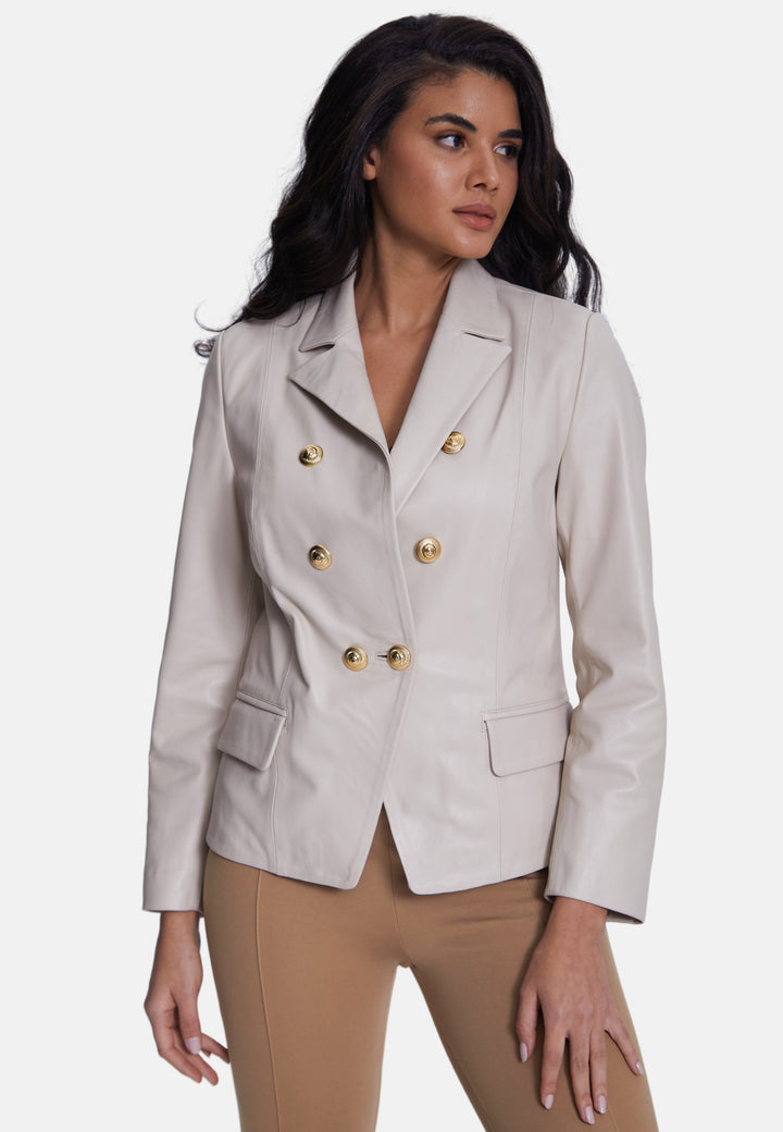 Woman wearing beige leather blazer