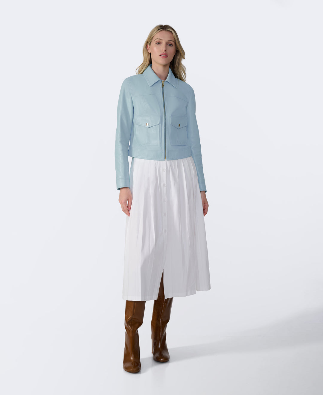 Woman in light blue leather jacket