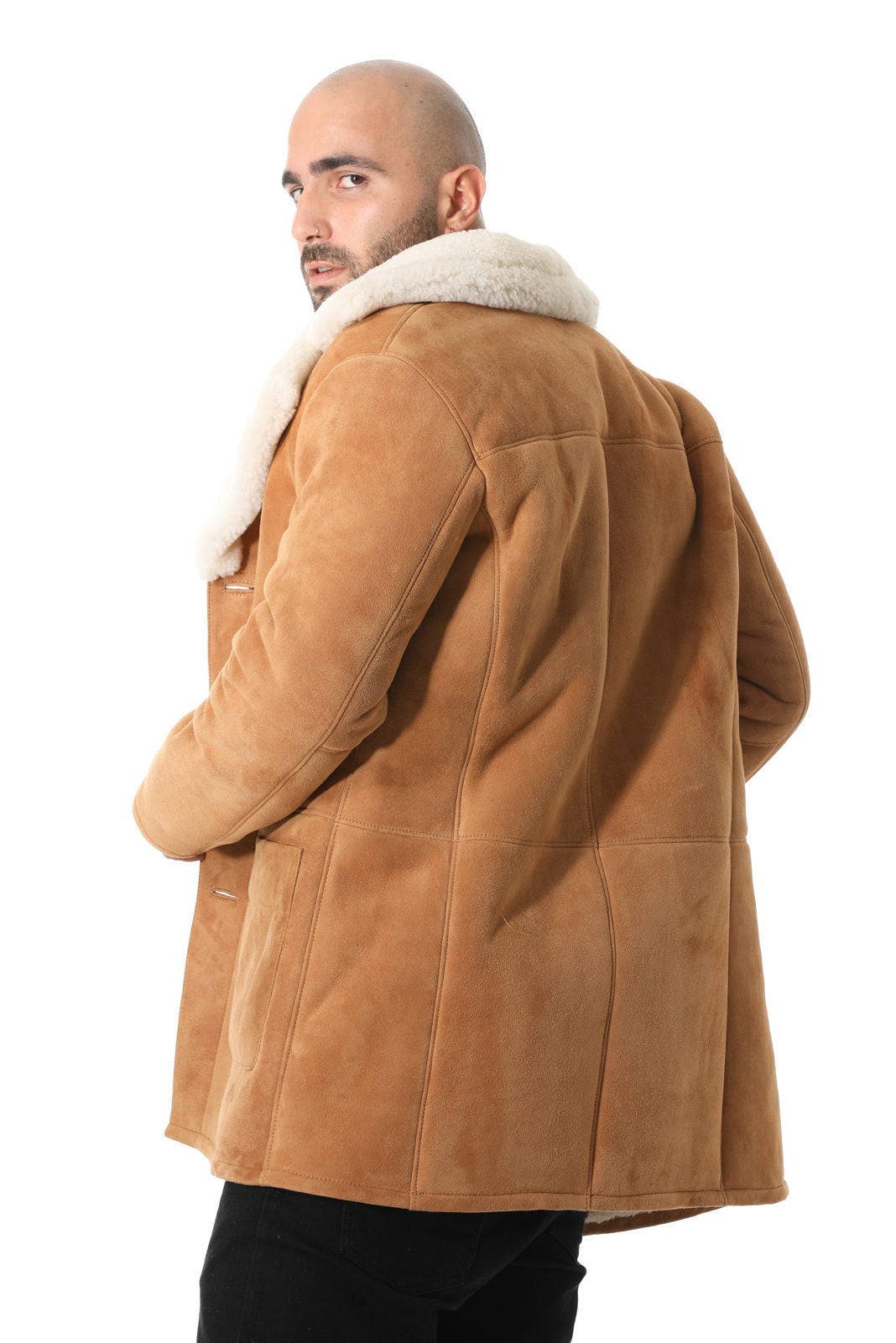 Man wearing tan sheepskin coat