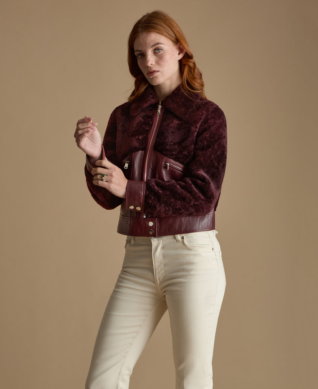 Emery burgundy leather and shearling jacket close up front view with zip pockets