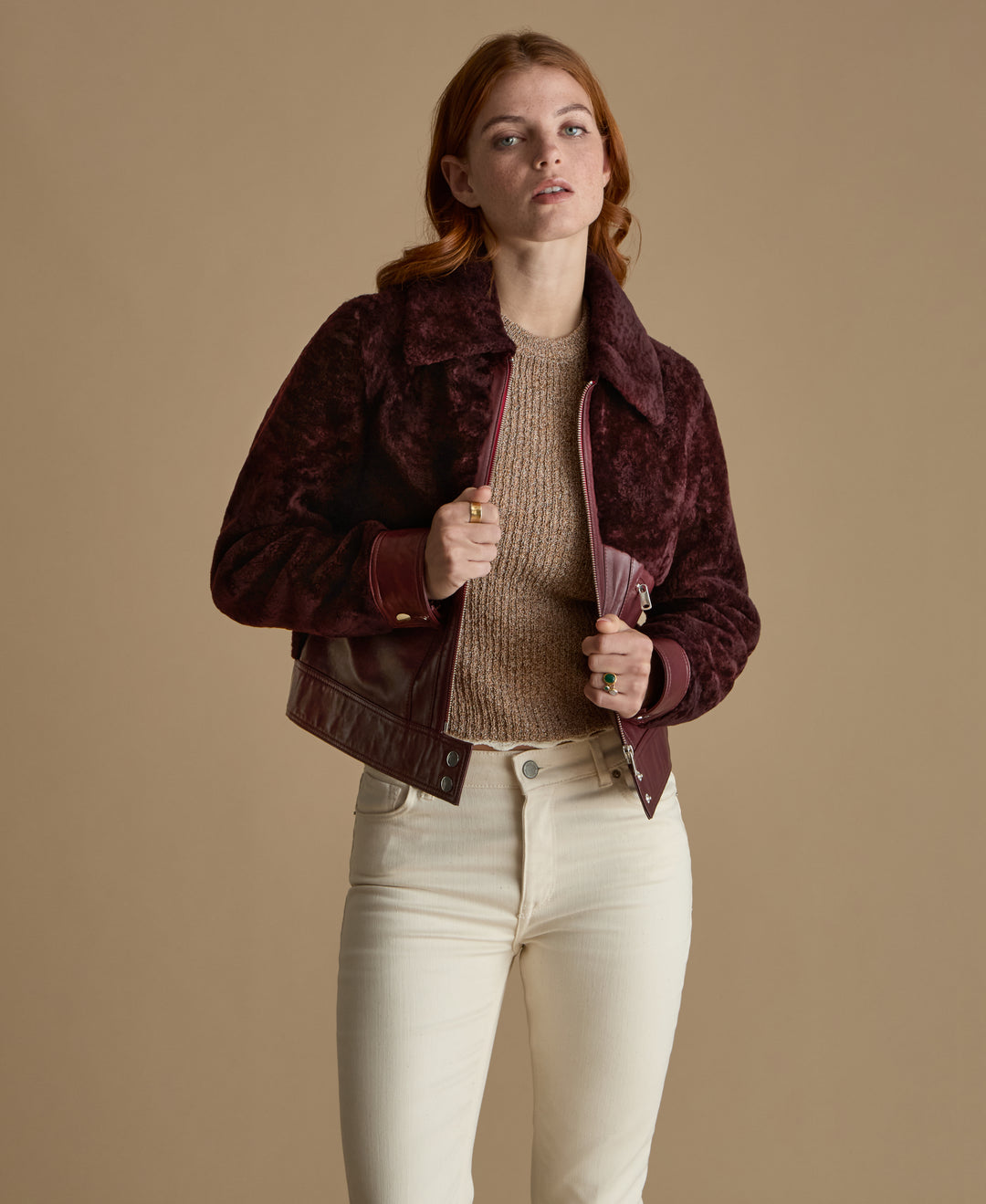 Emery burgundy leather and shearling jacket styled open with knitwear