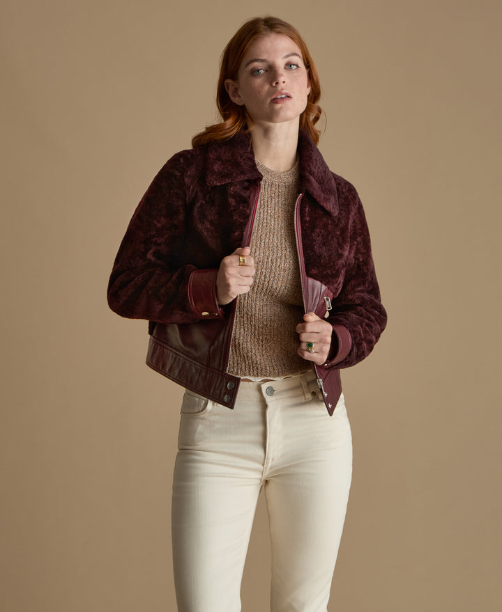 Emery burgundy leather and shearling jacket styled open with knitwear