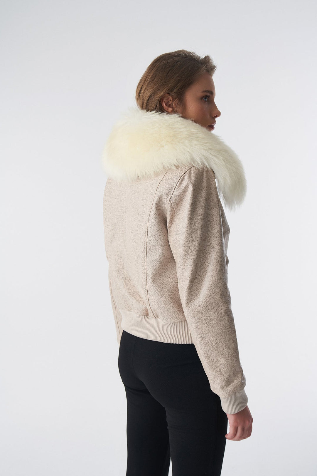 Beige bomber jacket with white fur collar
