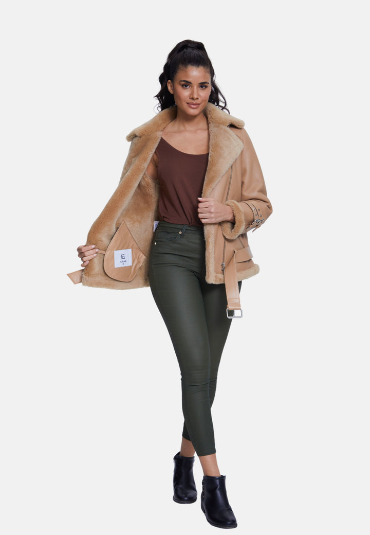 Woman wearing tan sheepskin jacket