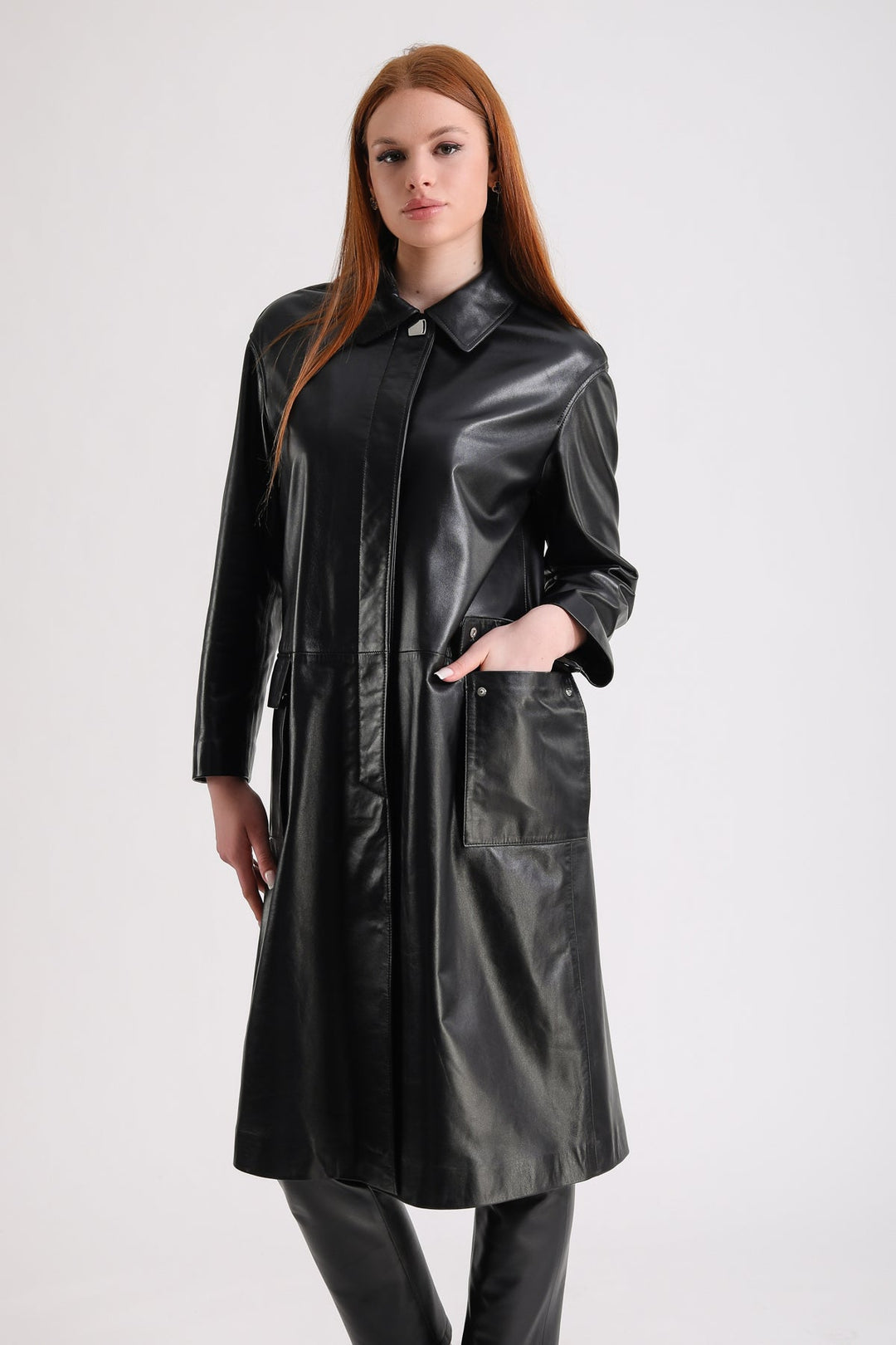 Woman wearing black leather trench coat