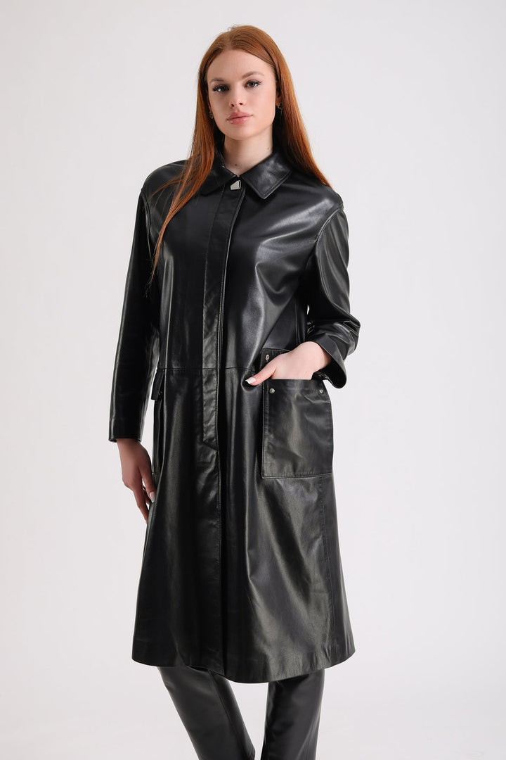 Woman wearing black leather trench coat