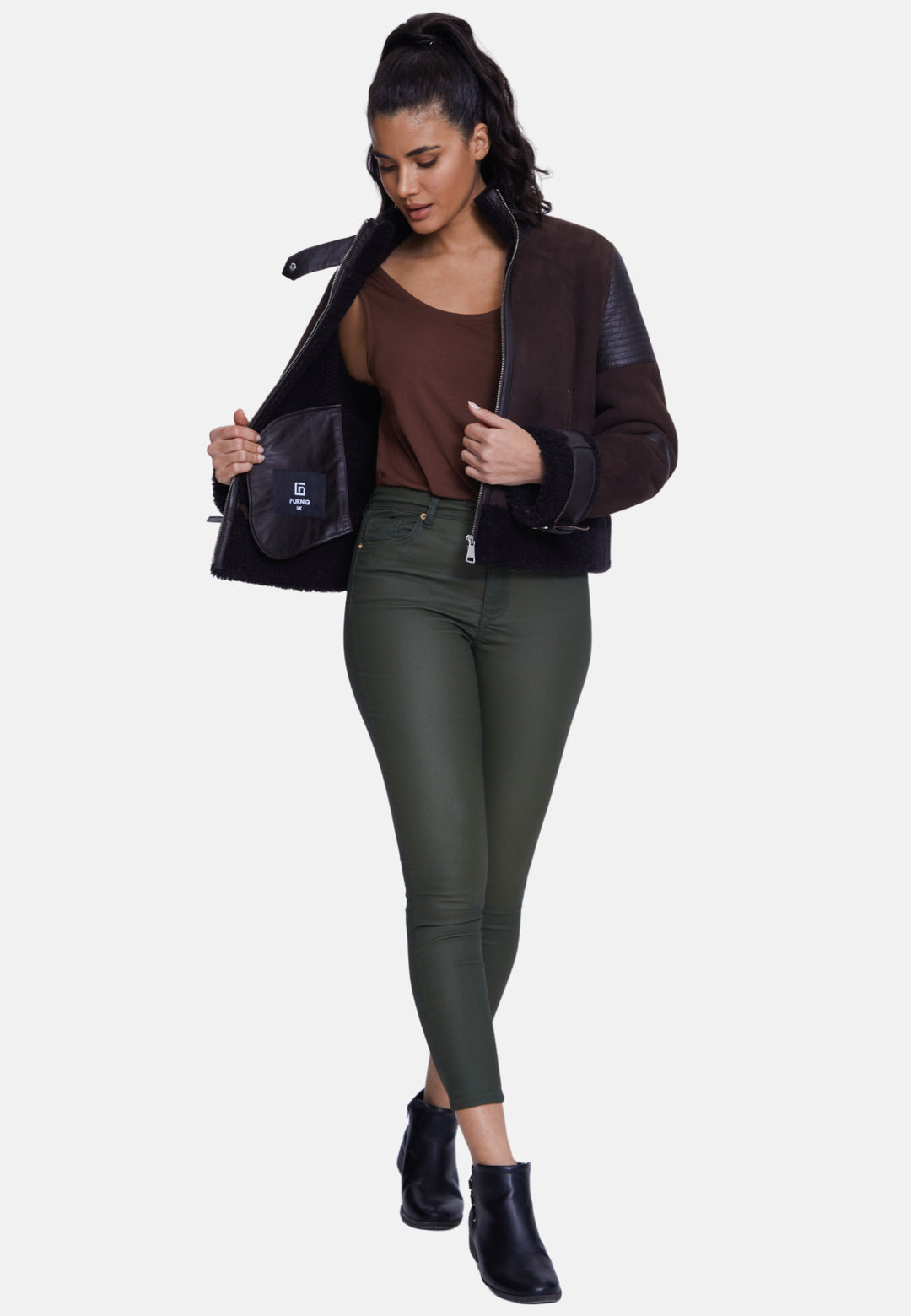 Woman wearing brown shearling jacket