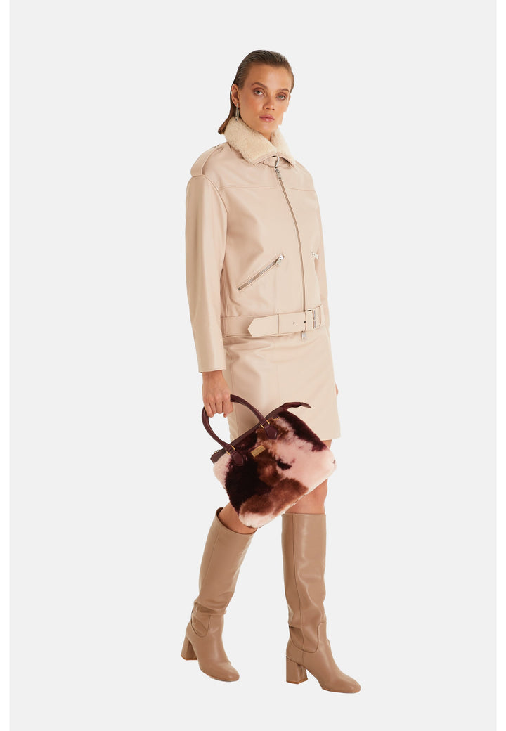 Woman wearing beige leather jacket