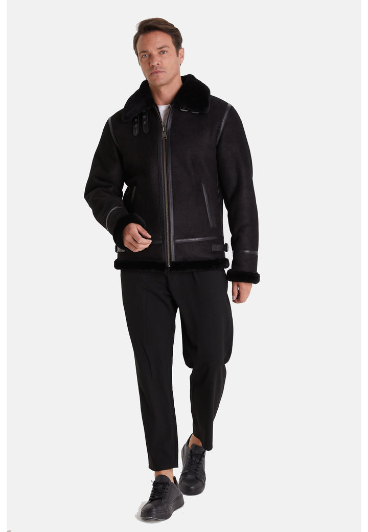 Man wearing black sheepskin aviator jacket