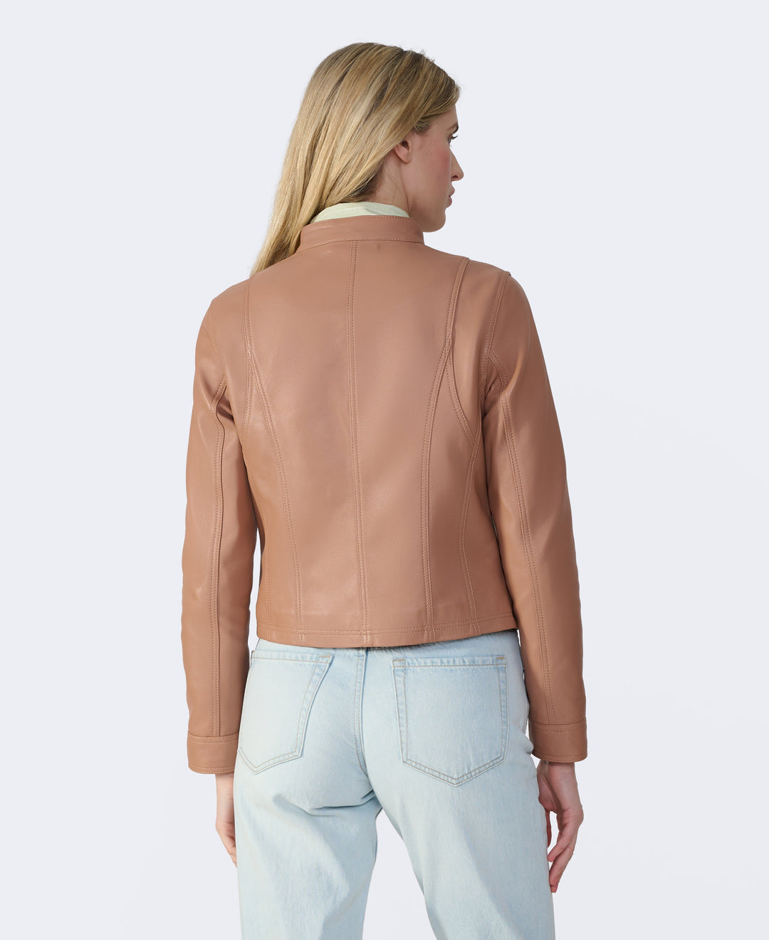 Woman wearing tan leather jacket back view