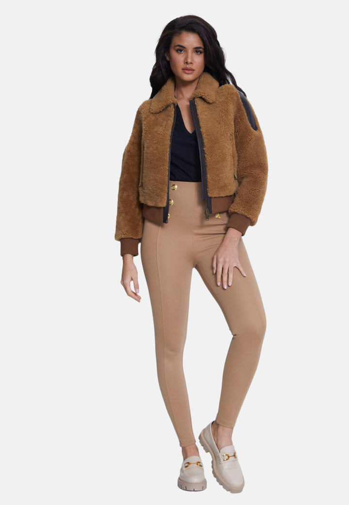 Woman wearing brown teddy jacket