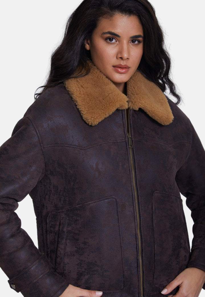 Woman wearing brown sheepskin jacket