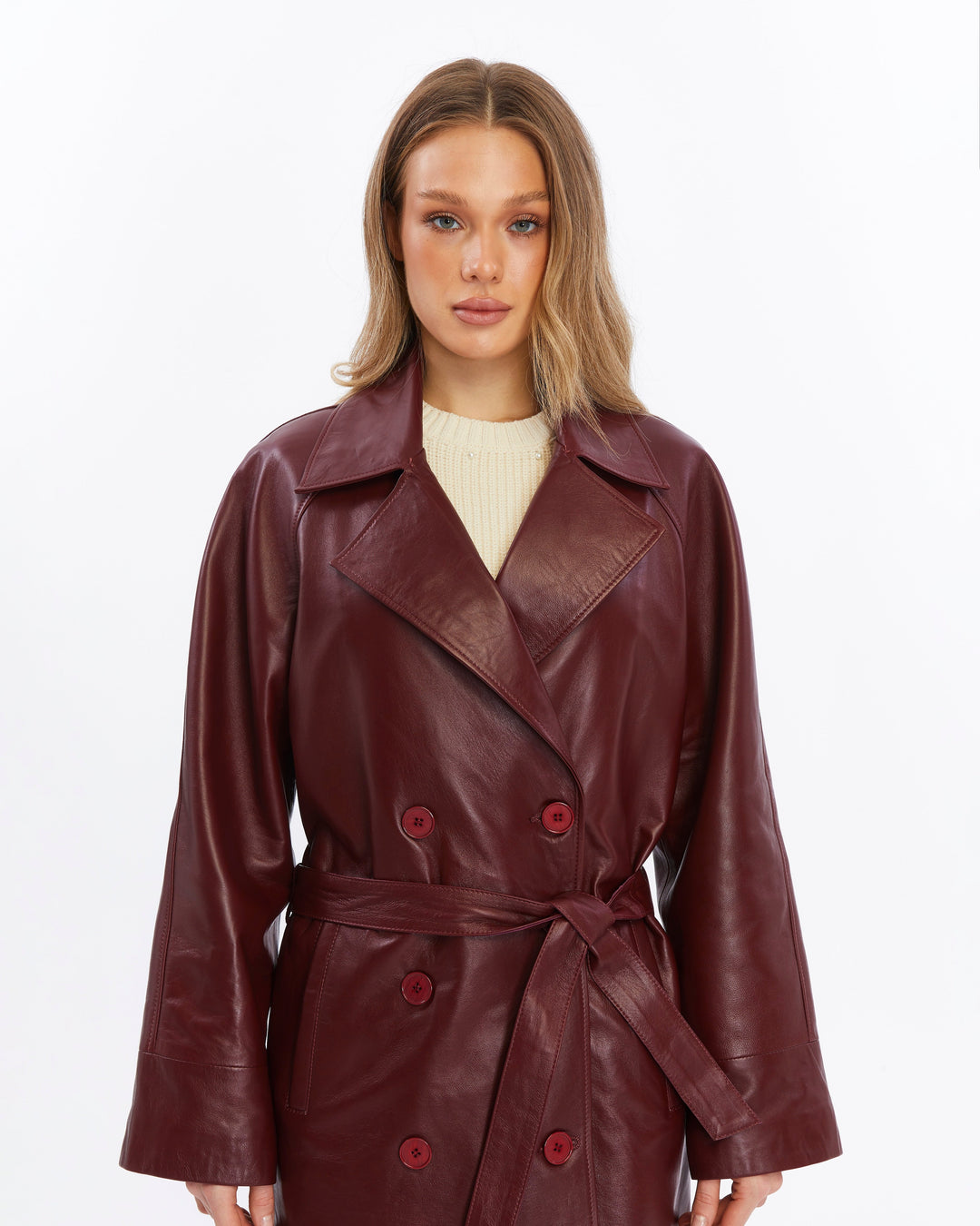 Woman wearing burgundy leather trench coat