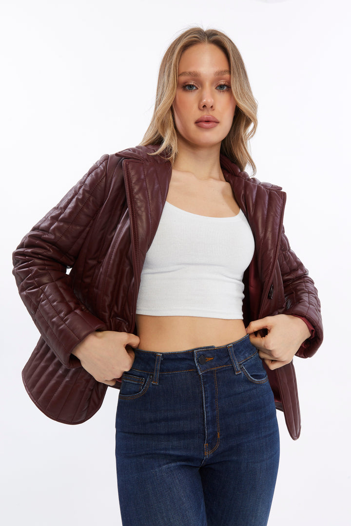 Woman wearing burgundy quilted leather jacket