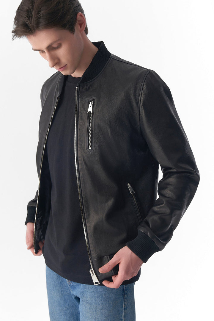 Black leather bomber jacket on model