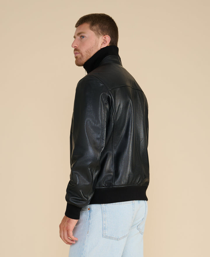 Male model wearing black leather jacket (back)