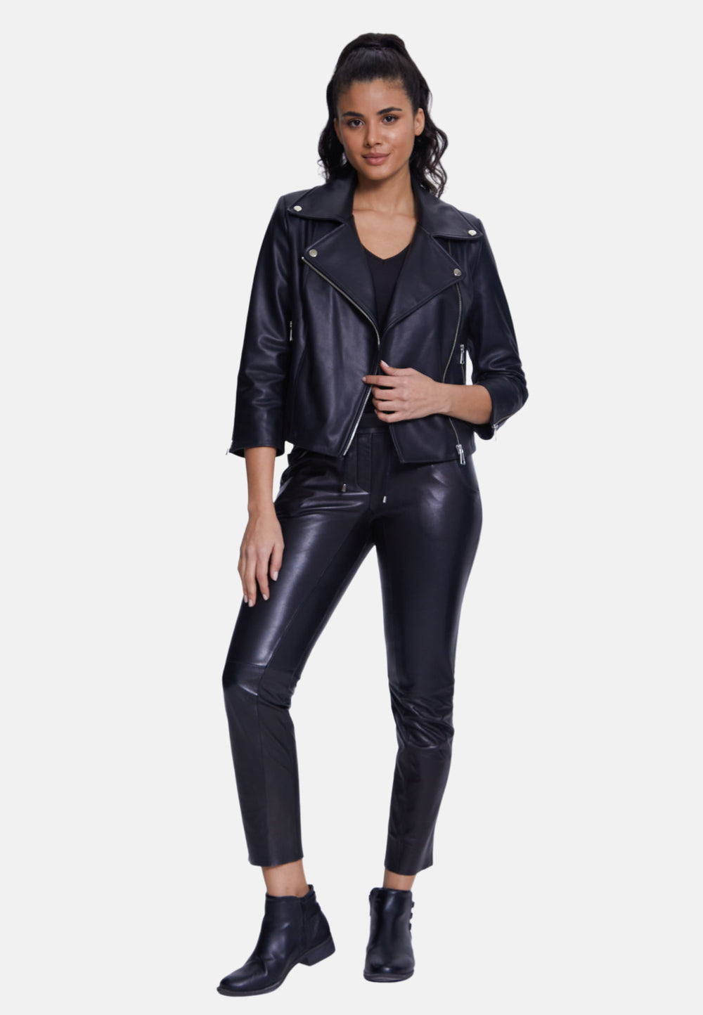 Woman wearing black leather biker jacket