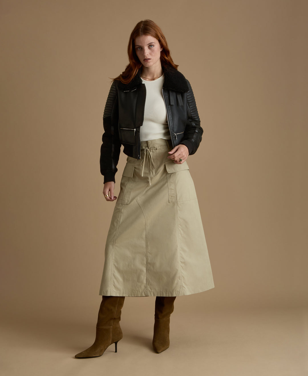 Woman in black shearling jacket