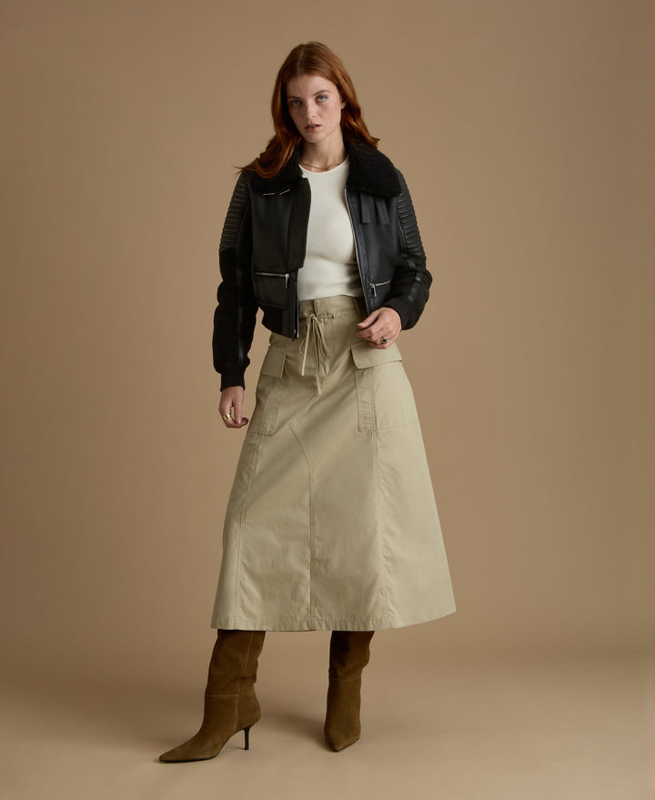 Woman in black shearling jacket