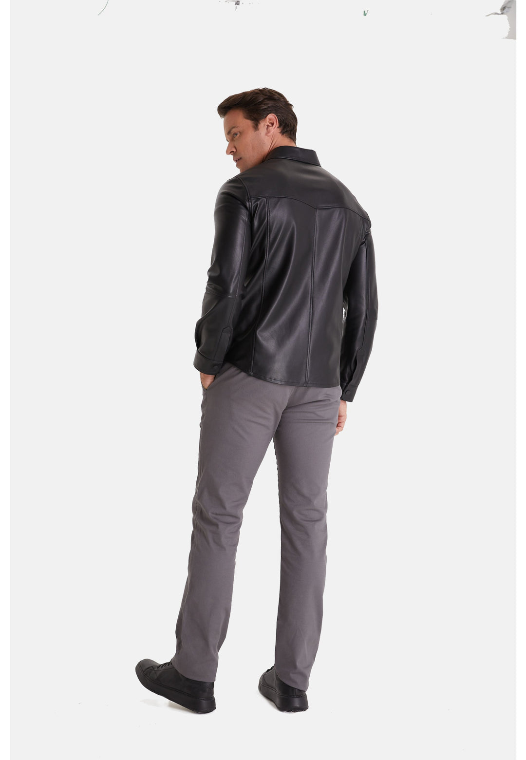 Man wearing black leather jacket back view