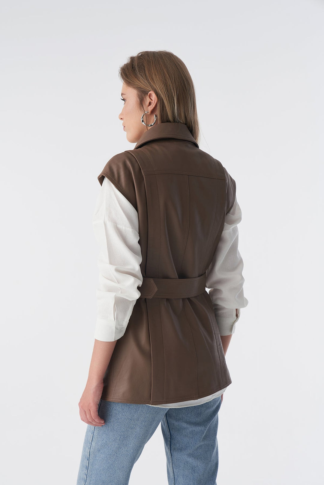 Brown leather vest on model