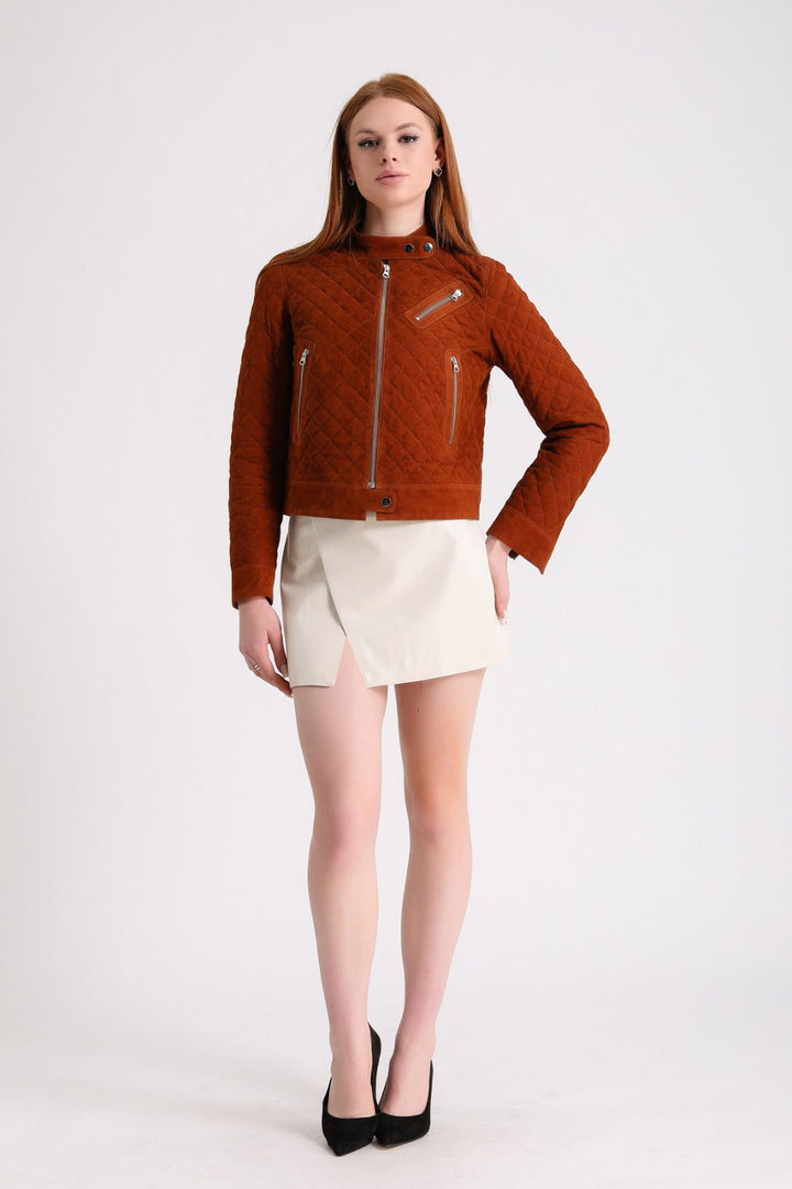 Woman wearing rust suede quilted jacket