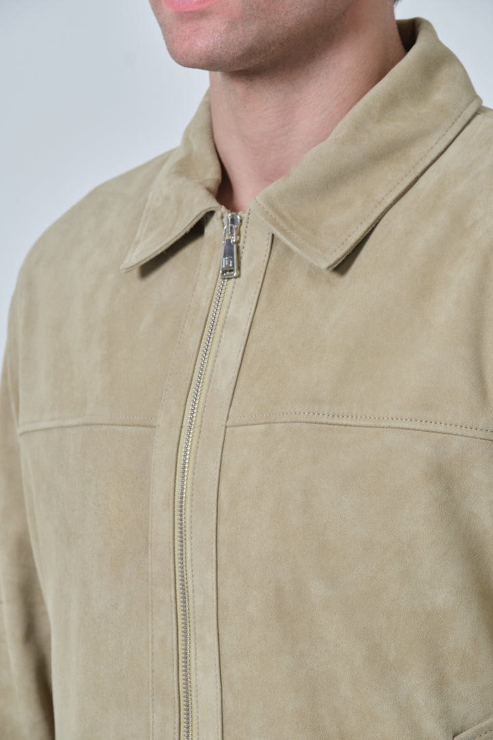 Close-up of Freddie sage green suede jacket collar and zip detail