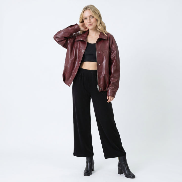 Full body look burgundy leather jacket styled with black outfit