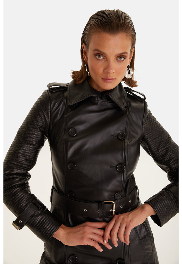Close-up of the Greenwich black leather trench coat showing the collar, shoulder epaulettes and cuff straps.