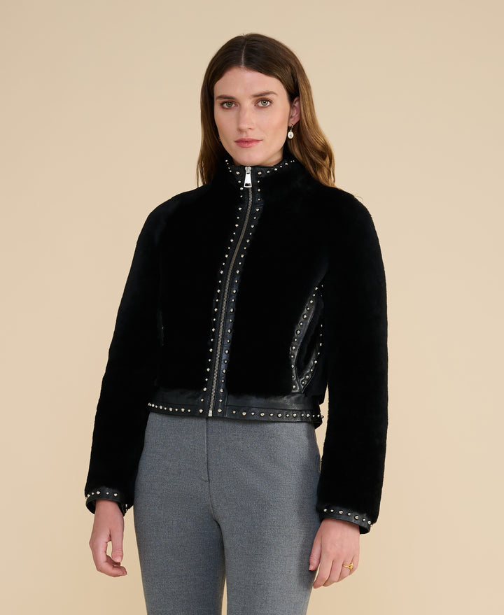 Harper black studded shearling jacket front view with stand collar and stud detailing