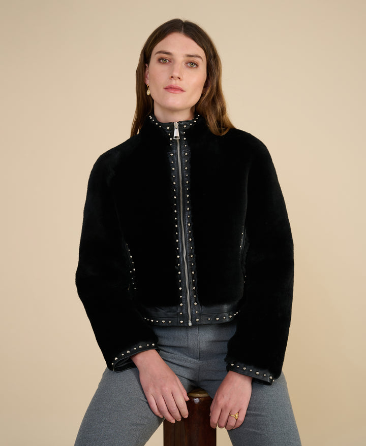Harper black studded shearling jacket styled for Fall Winter 2026 luxury fashion