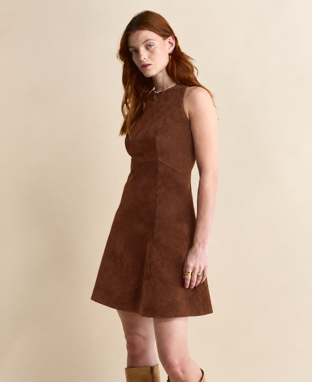 Three-quarter front view of the Helene Suede Dress in chestnut brown, showing the sleeveless cut and A-line skirt.