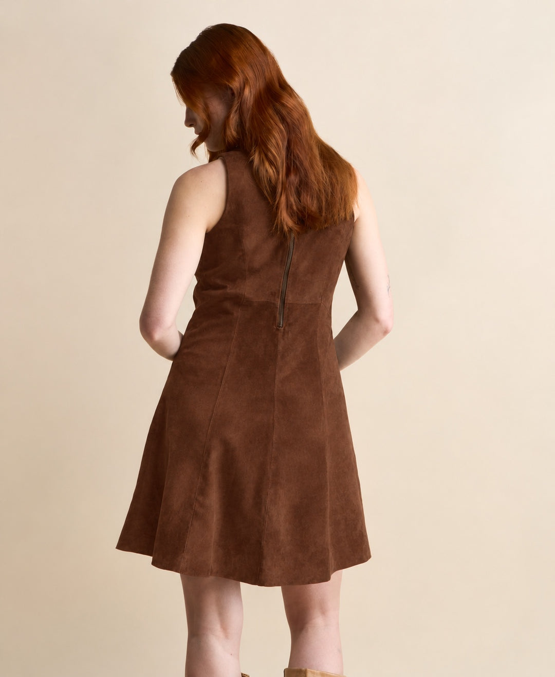 Back view of the Helene Suede Dress in chestnut brown, showing the zipper fastening and panel seams