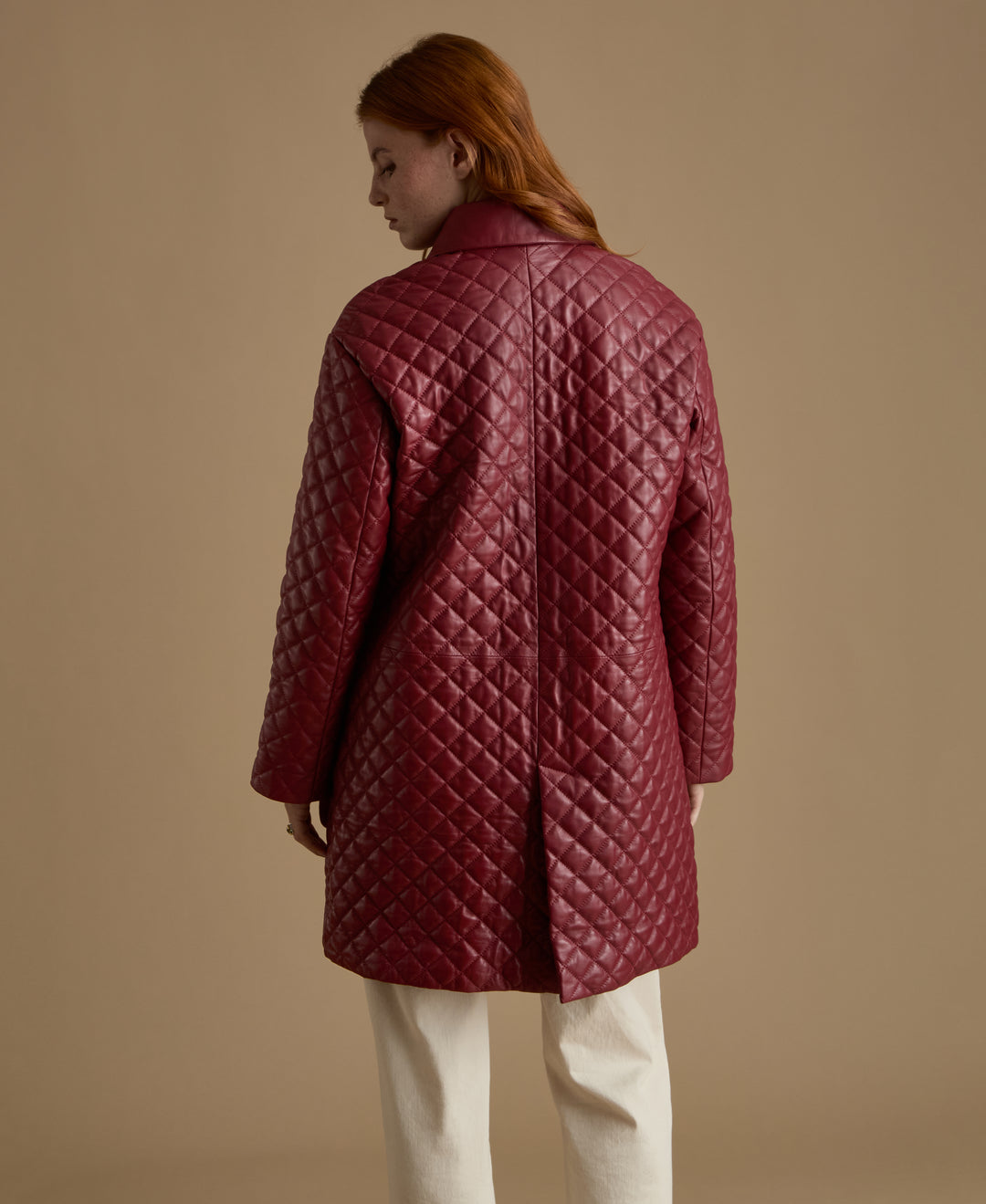 Back view of Holland light burgundy quilted leather coat with quilted diamond detailing