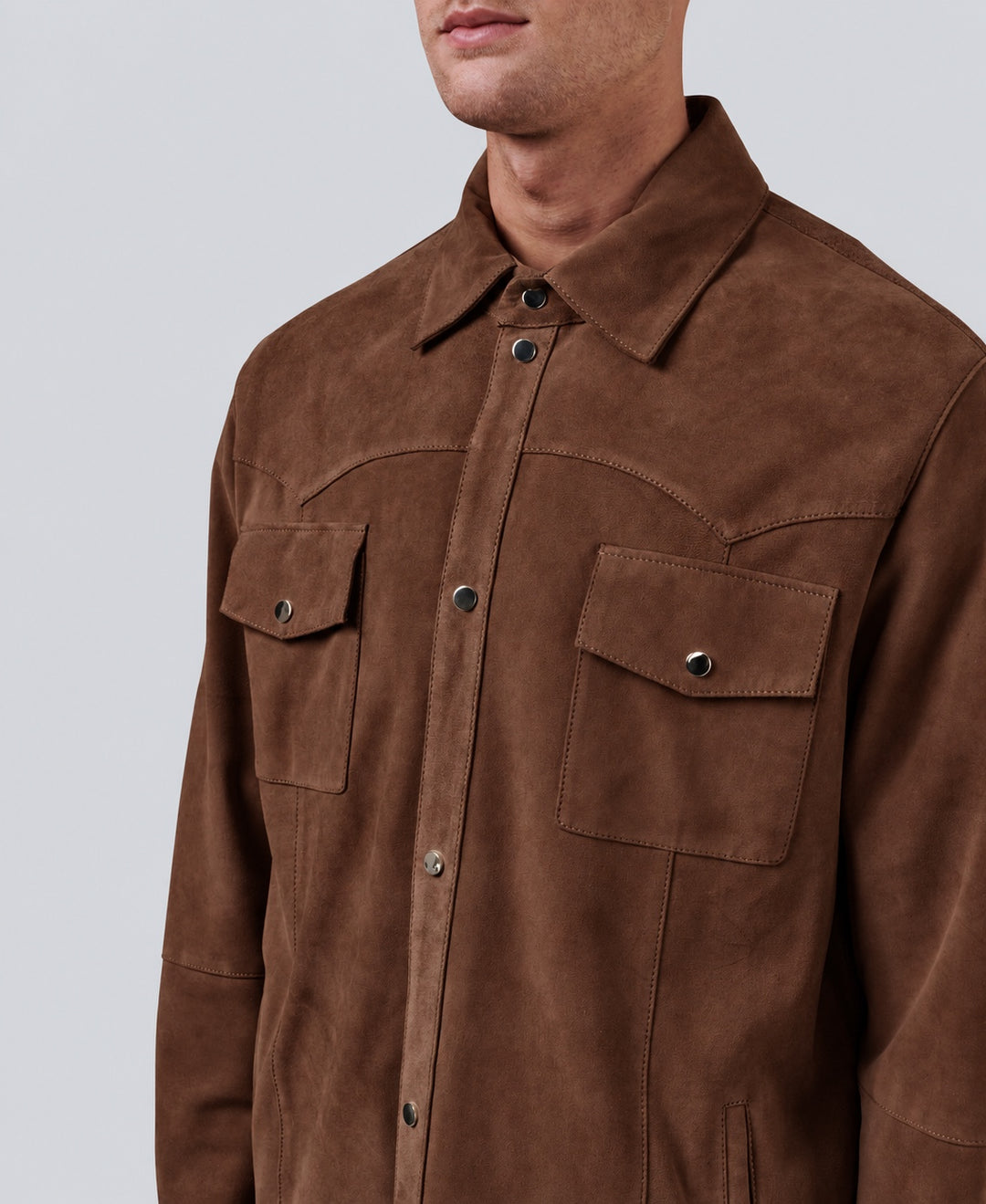 Close-up of the Jett Suede Shirt Jacket in Chestnut, showing the suede texture, pointed collar and snap chest pockets.